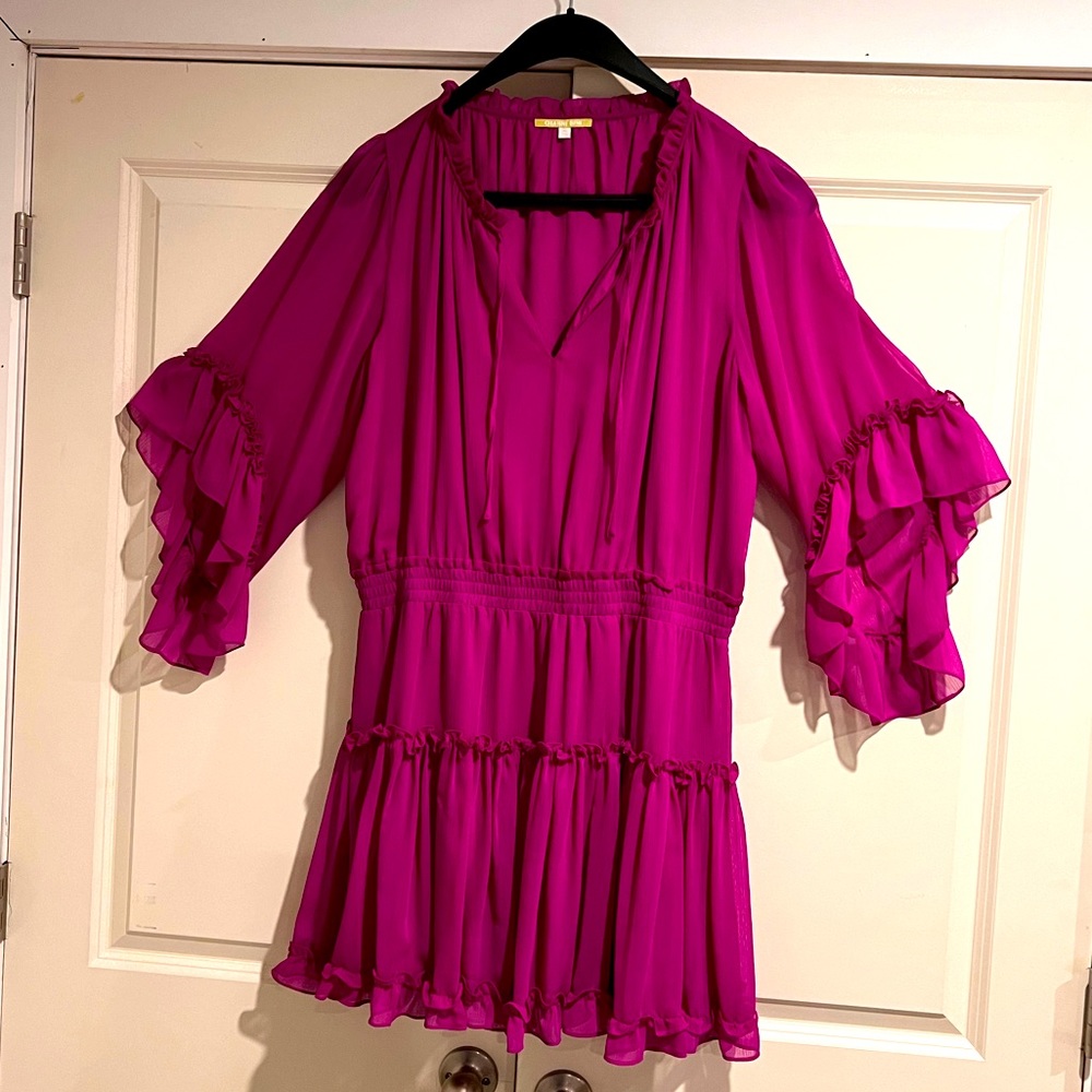 Great Dress!  Very flattering, sexy and modern yet not revealing.